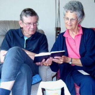 Mike and Jill Vaughan with a BCP prayer book