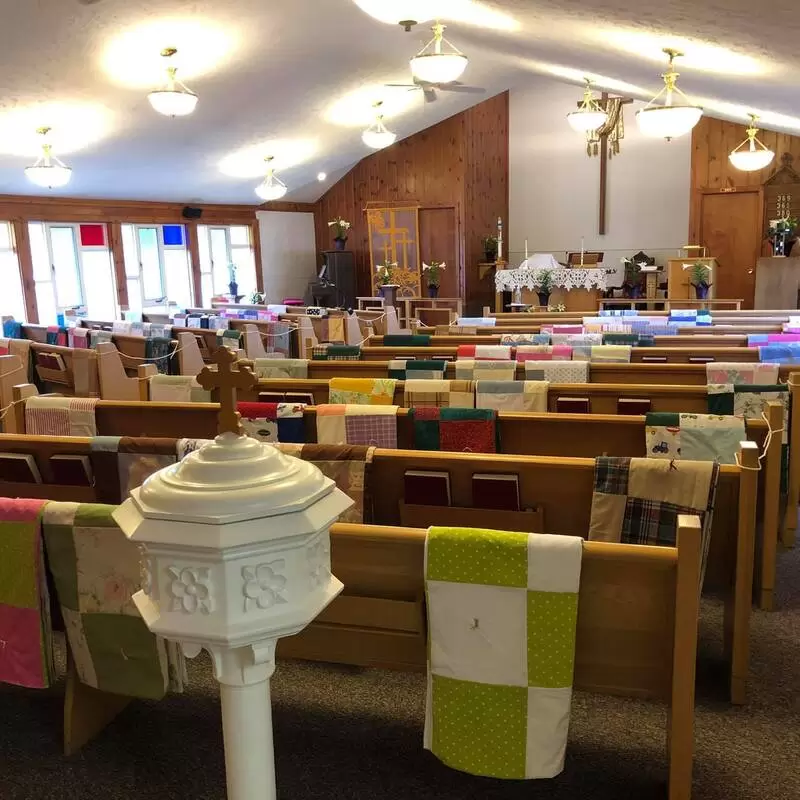 The sanctuary decorated with the quilts and Easter Lillies (2021)