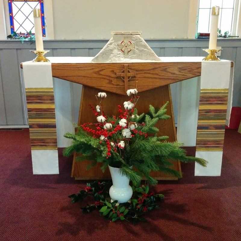 Christmas altar flowers for the 8 pm service