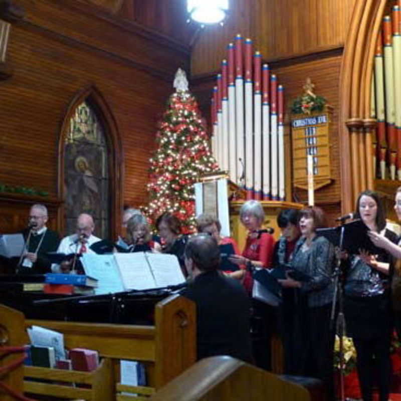 The adult Christmas drama chorus during one of the Christmas Eve services