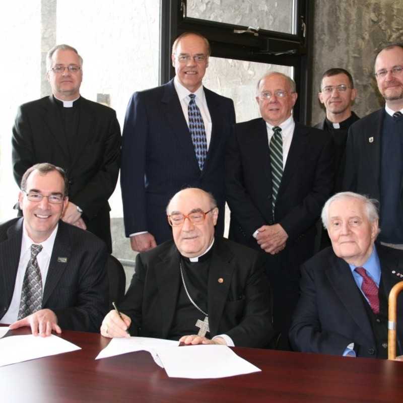 Catholic College Signing by Bishop De Angelis and President Steven E. Franklin