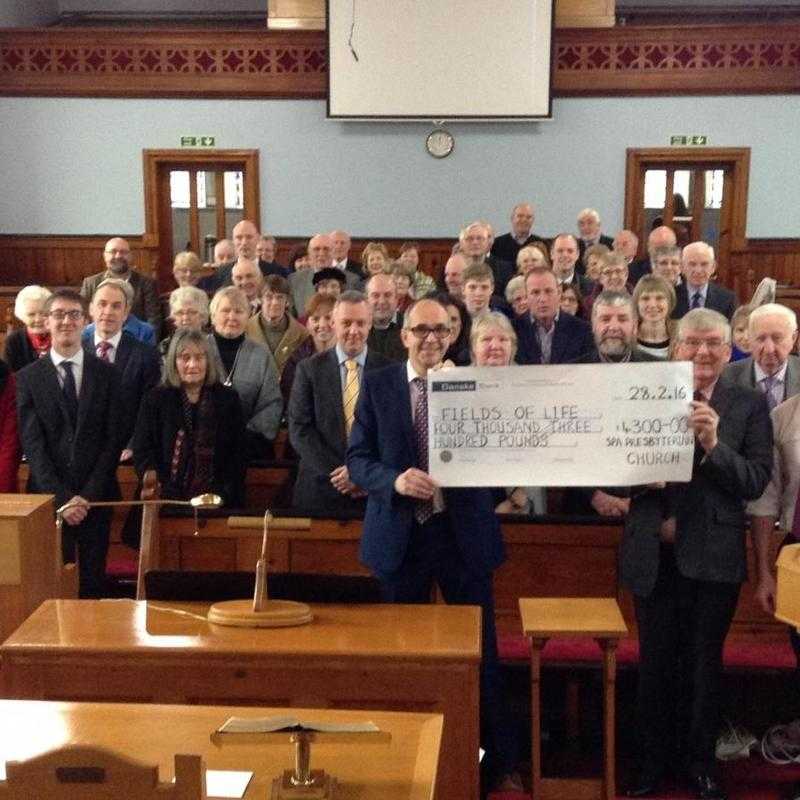 Spa Presbyterian Church presents cheque to the Charity Fields of Life