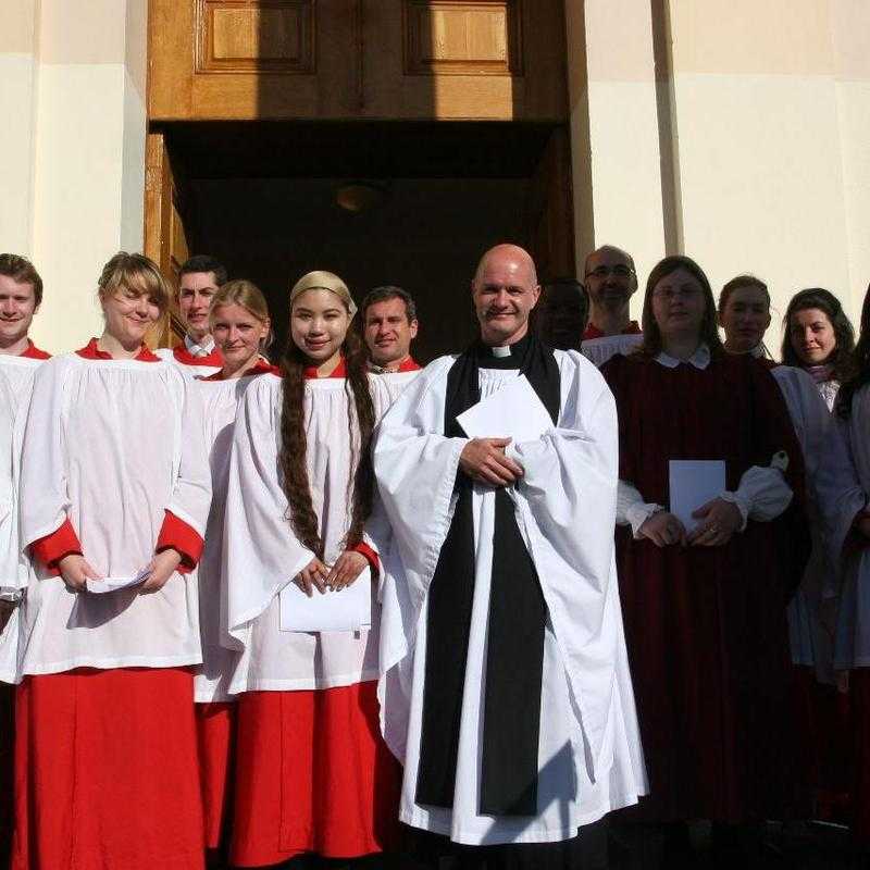 Rector and choir at Thanksgiving Service in April 2010