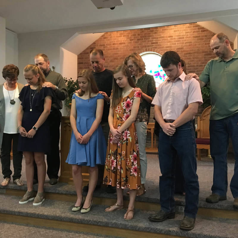 Praying over our 2019 Graduates