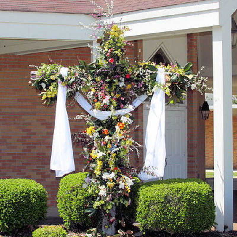 Cross draped in white with flowers 2010
