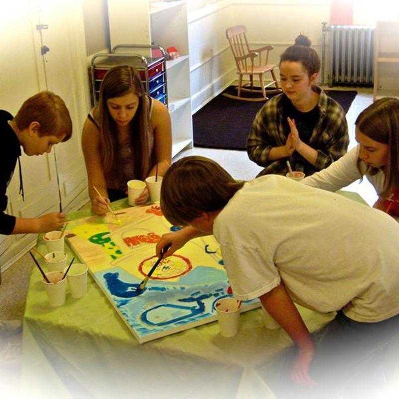 The youth at APCC collaborate on a painting of Noah's Ark