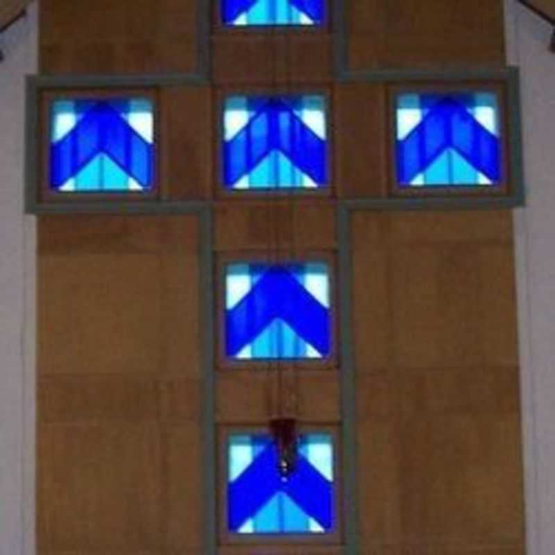 Large window cross  at the front of the altar