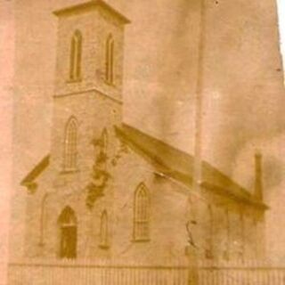 An older photo of St. Philomena's. Note fence. Photo presented by Wilf Garrah