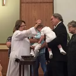 Pastor Carol baptizing Braxton
